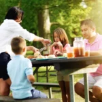 depositphotos_325812602_stock_photo_family_four_eating_barbecue